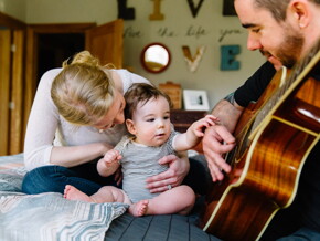 Baby listening to daddy play guitar Baby listening to daddy play guitar