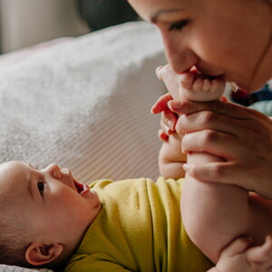 Mother kisses baby