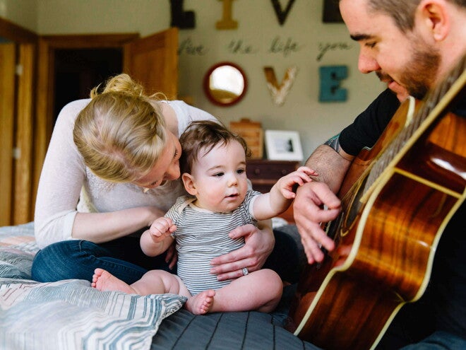 Baby listening to daddy play guitar Baby listening to daddy play guitar